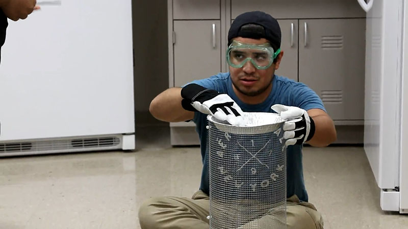 Demonstration of how to install the Aluminum pie pan trap on the cage frame